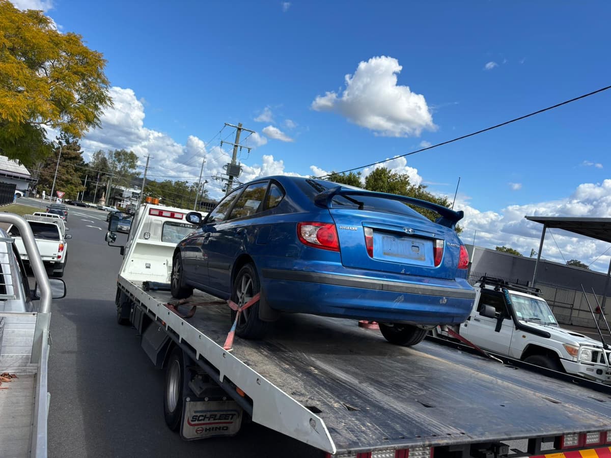 Illustration of a car being recycled with green leaves, symbolizing eco-friendly car recycling in Brisbane.